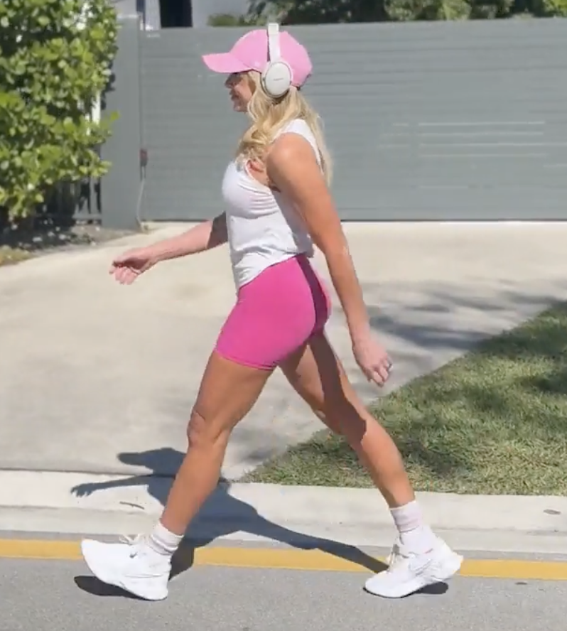 chalene johnson walking on street wearing pink