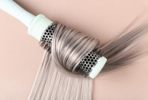 Gray blending hair with a round brush